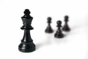 Black Chess King with Pawns Our opponent appears to be outside of us, but it is within.